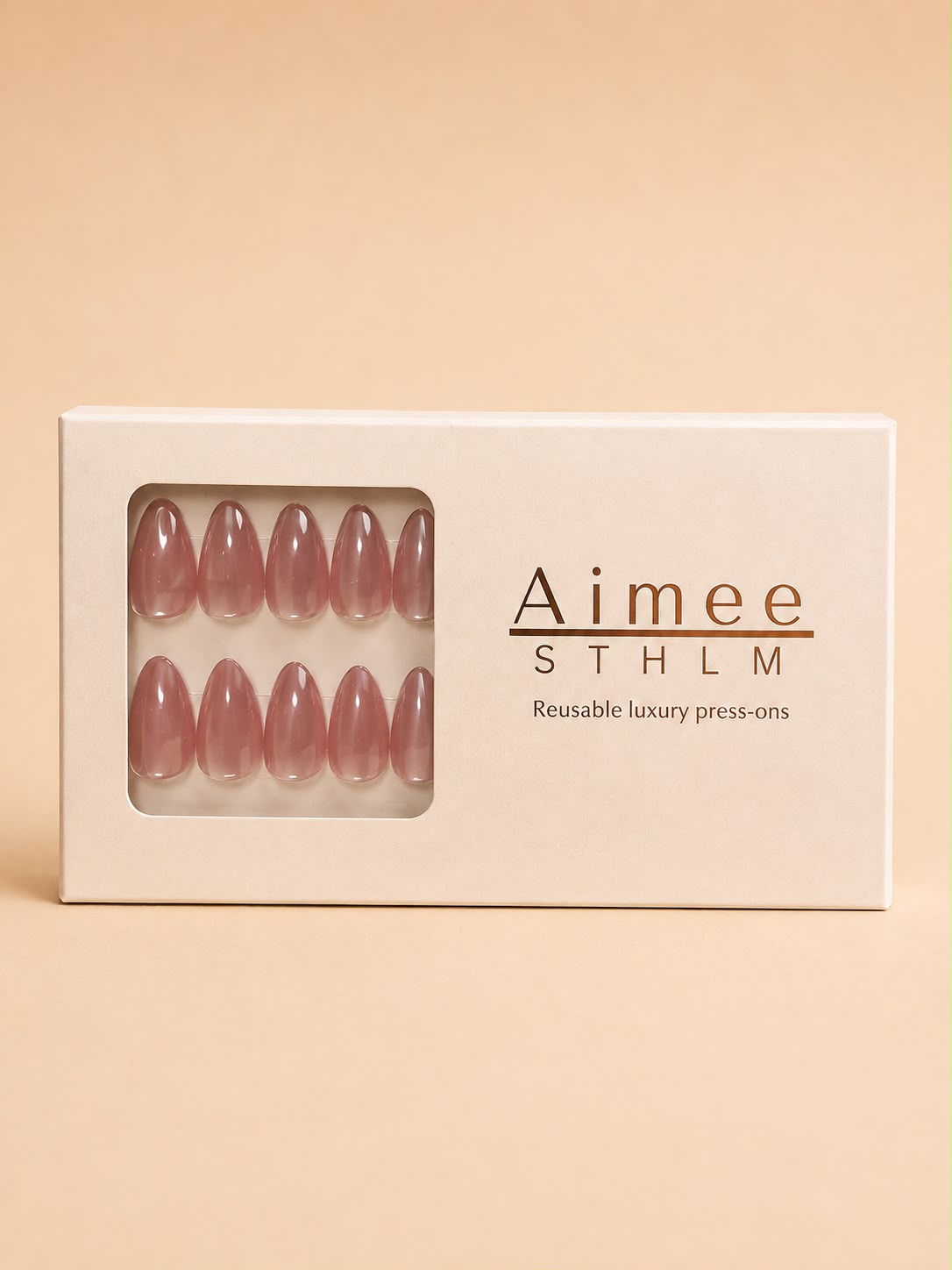 Rosé Glow-Schachtel – Wiederverwendbare rosa Cat-Eye-Kunstnägel in der Form „Short Almond“, verpackt in einer exklusiven Schachtel von Aimee STHLM